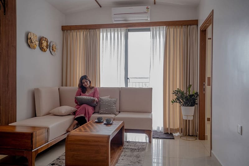 women siting in comfortable sofa in an minimalist interior of a house
