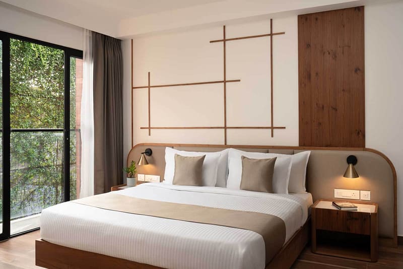 Bedroom design with bed and wall paper