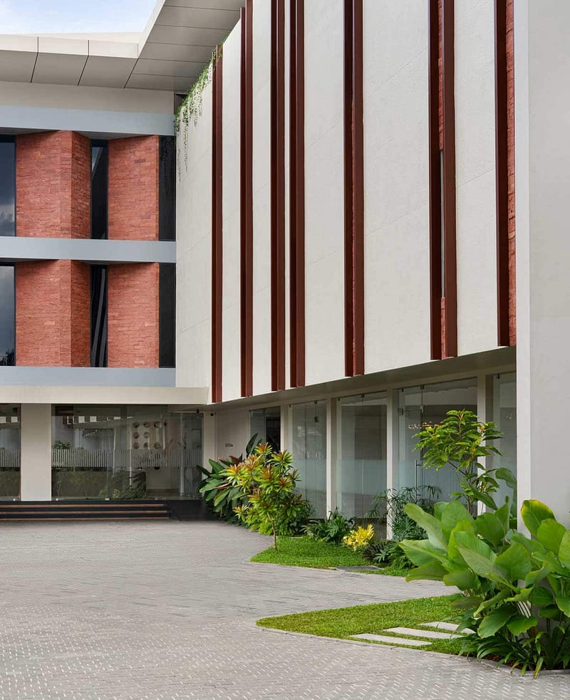 beautiful Modern building by lykke architects in kakkanad with greenery and design.